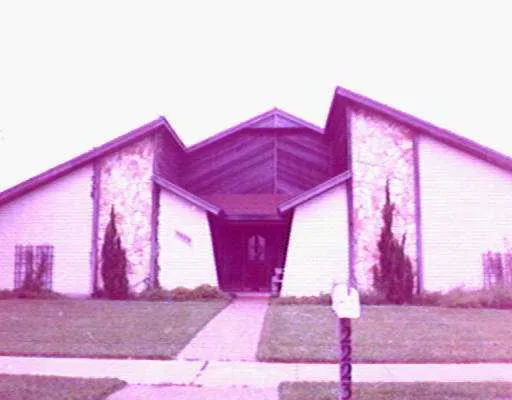 a view of a living room with a red couch