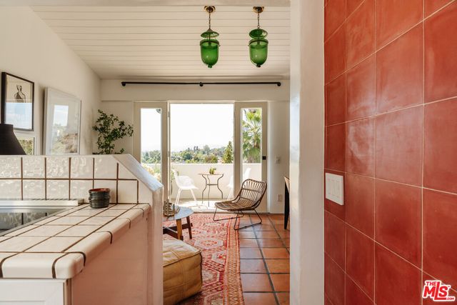 a bedroom with a bed and a chair