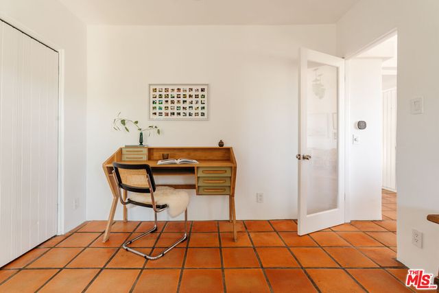 a bed room with a bed and a window