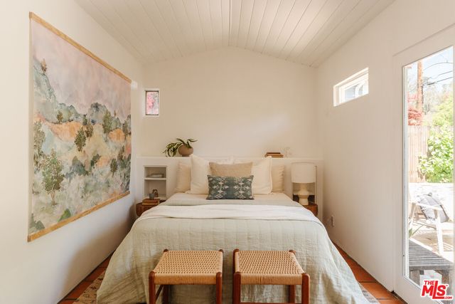a view of a patio with table and chairs and potted plants