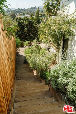 a view of a livingroom with furniture and a flat screen tv