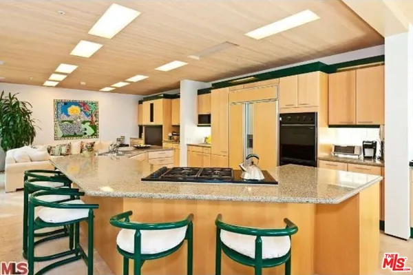 a dining table with chairs and window