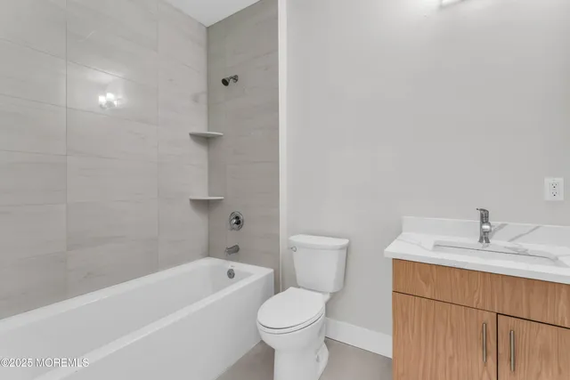 a bathroom with a sink toilet and bathtub