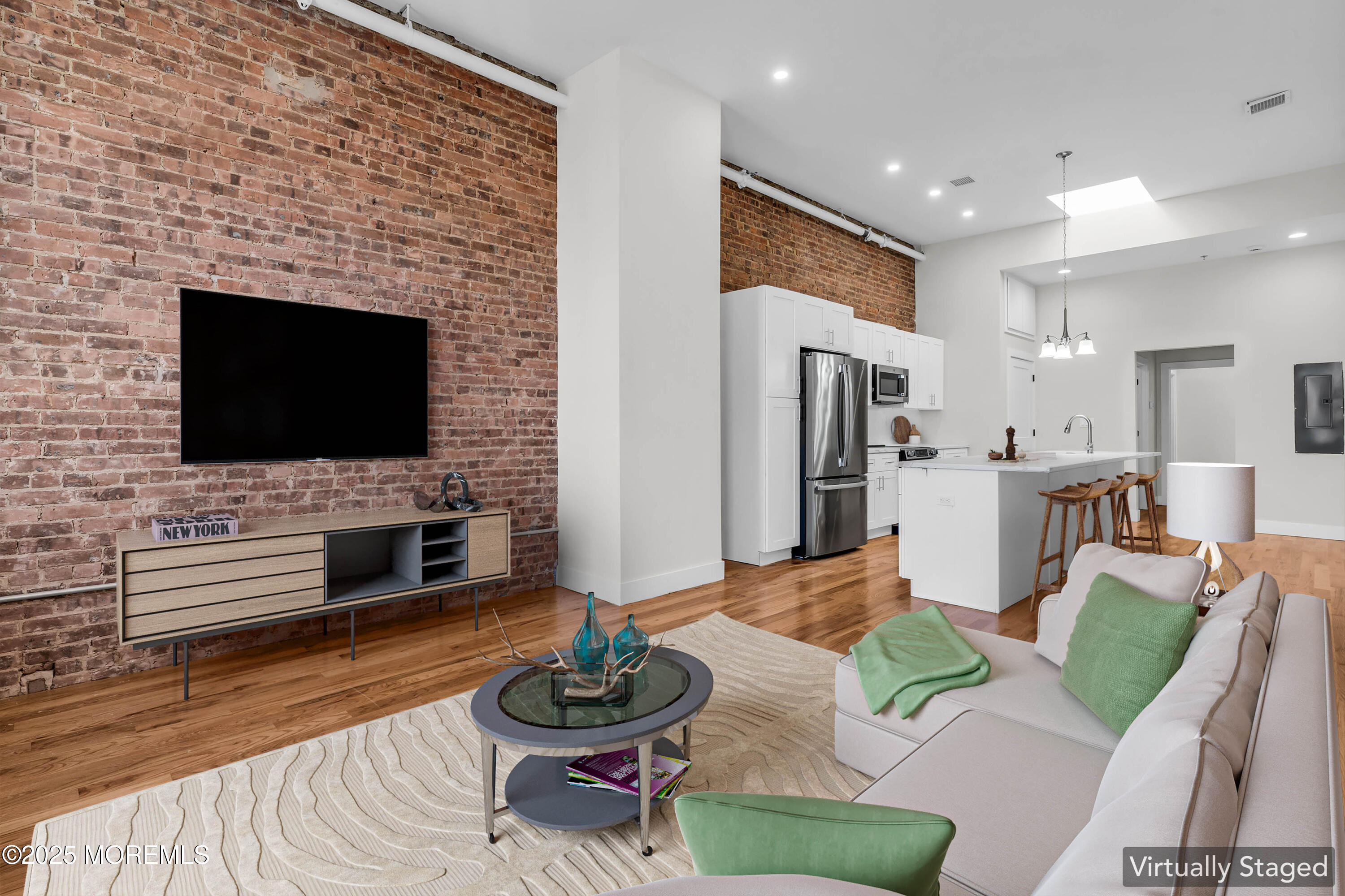 7 Broad Street, Unit 3 Red Bank, NJ 07701 - Photo 8 of 18 a living room with furniture and a flat screen tv