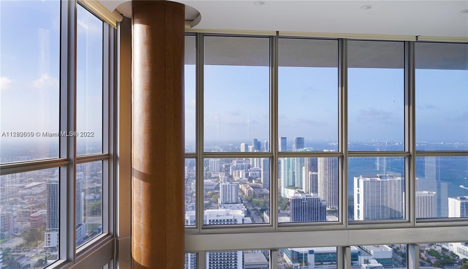 1100 Biscayne Boulevard, Unit 6307 Miami, FL 33132 - Photo 15 of 19 a view of a glass door next to a yard from a balcony