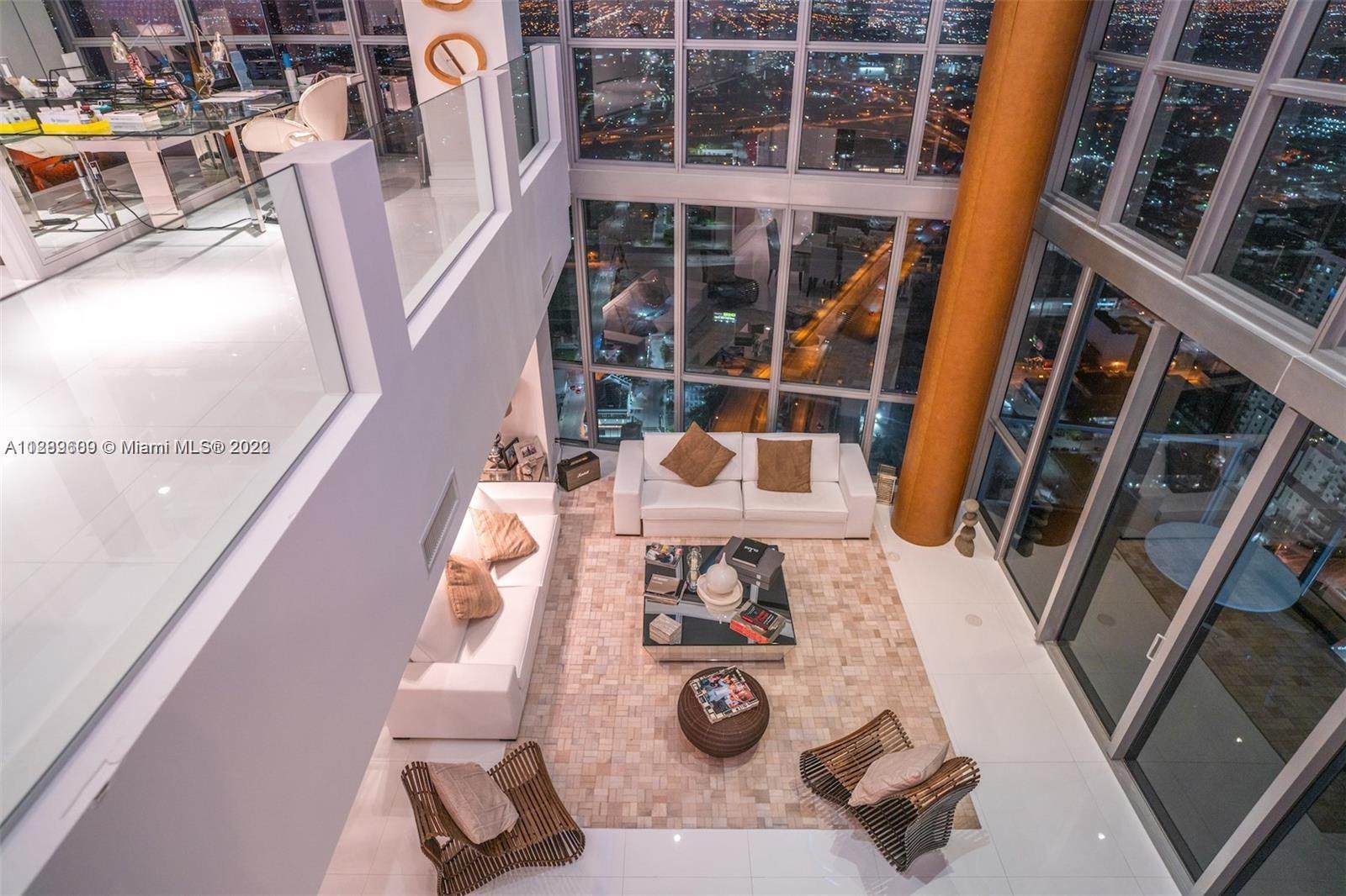 1100 Biscayne Boulevard, Unit 6307 Miami, FL 33132 - Photo 18 of 19 a view of living room with furniture and wooden floor