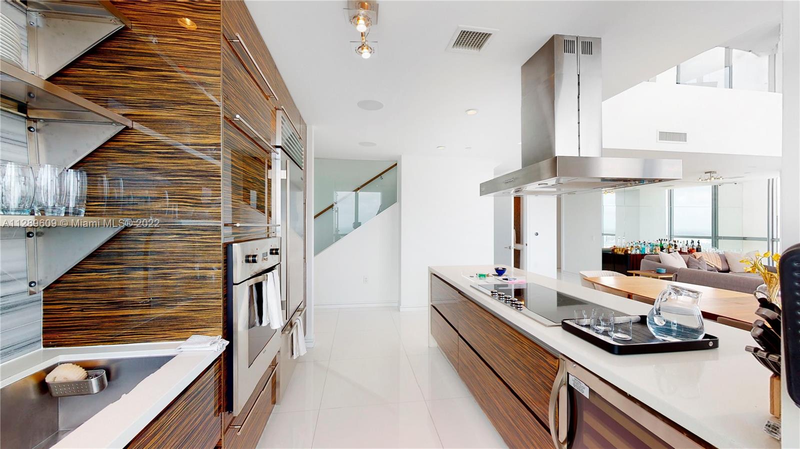 1100 Biscayne Boulevard, Unit 6307 Miami, FL 33132 - Photo 5 of 19 a view of gym equipment and living room view