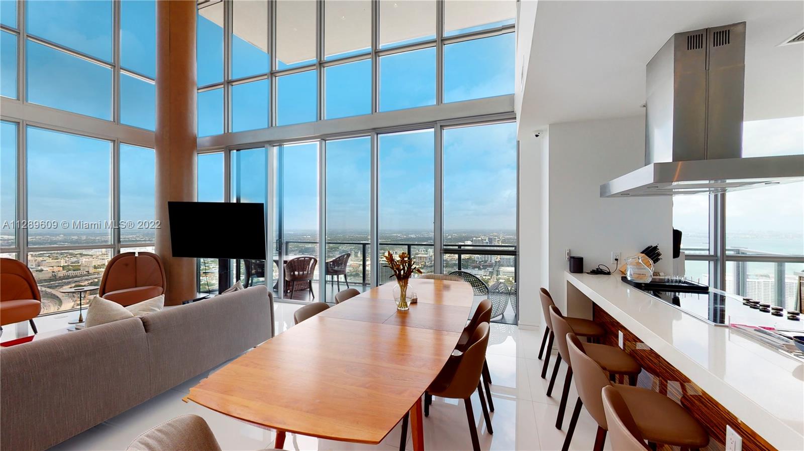 1100 Biscayne Boulevard, Unit 6307 Miami, FL 33132 - Photo 6 of 19 a view of a dining room with furniture window