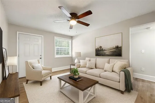 a living room with furniture and a large window