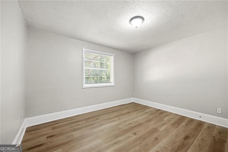 156 Fairfield Place Northwest Atlanta, GA 30314 - Photo 13 of 17 an empty room with a window