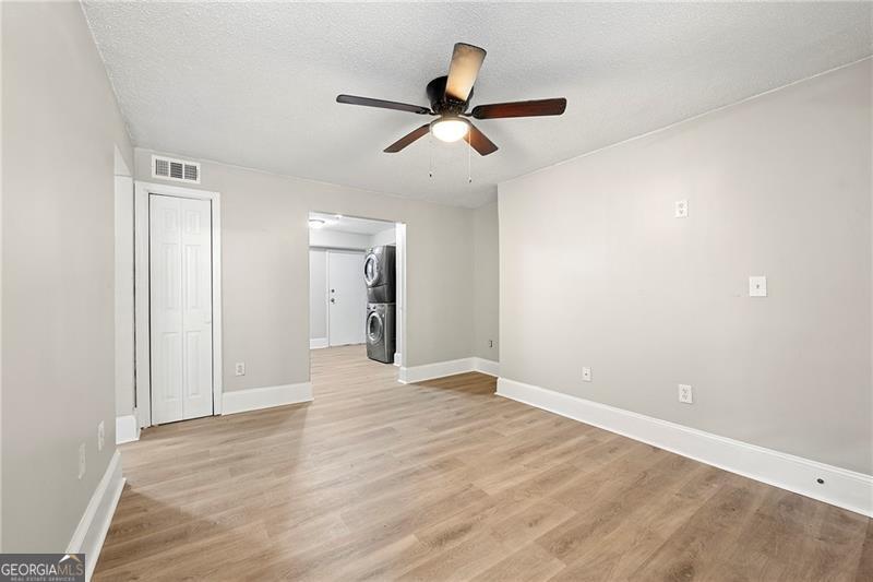 156 Fairfield Place Northwest Atlanta, GA 30314 - Photo 4 of 17 a view of an empty room and wooden floor