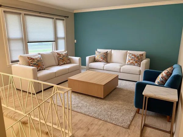 a living room with a couch and a large window