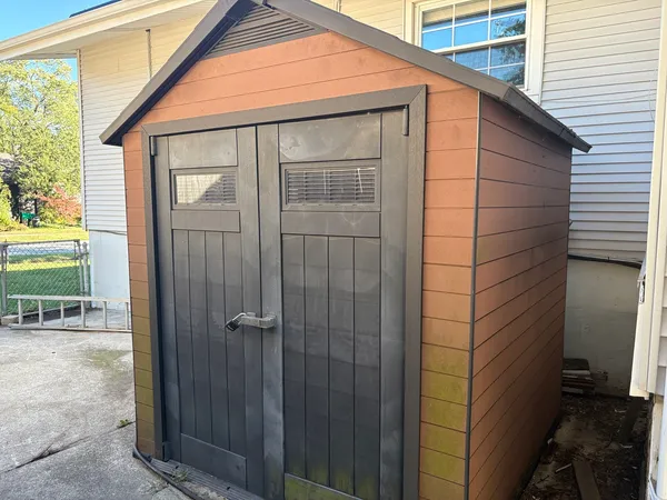 a view of a house with a door and wooden floor