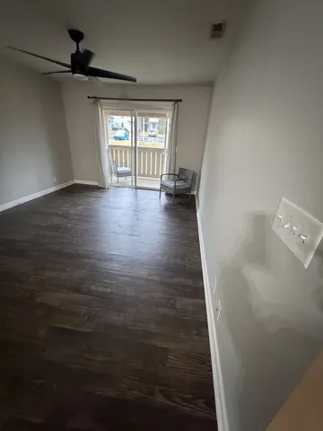 a view of a hallway with a window