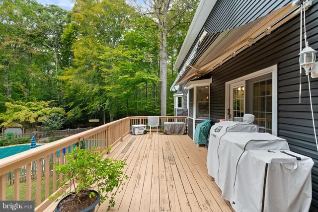 a view of balcony with furniture and wooden deck