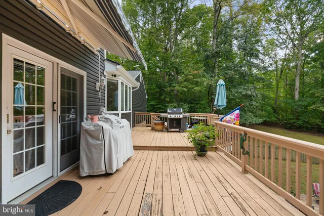 a view of balcony with deck and wooden floor