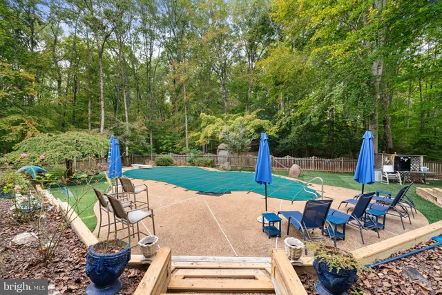 a view of a patio with couches chairs and a fire pit