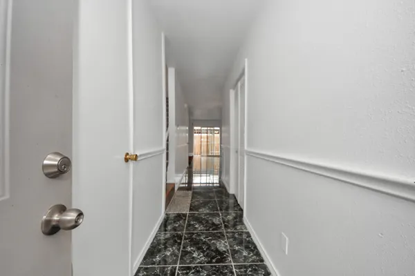 a view of a hallway with closet
