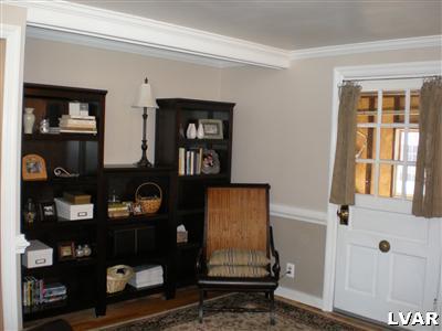 945 Birch Road Hellertown, PA 18055 - Photo 12 of 24 Family room - crown molding too. Doors leads to the garage.