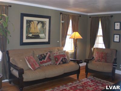 945 Birch Road Hellertown, PA 18055 - Photo 13 of 24 Nice size formal living room - crown molding, hardwood floors.