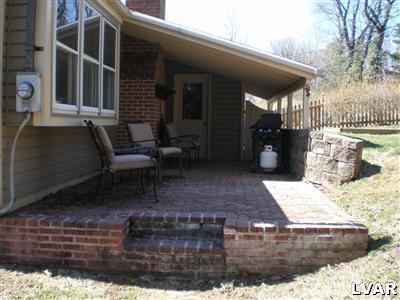 945 Birch Road Hellertown, PA 18055 - Photo 2 of 24 Brick paver patio perfect for outdoor entertaining even on a rainy day.