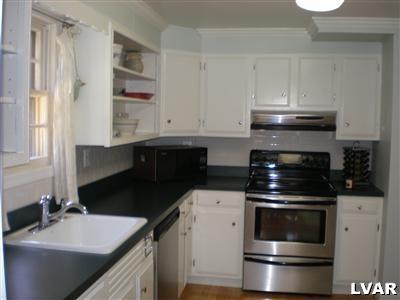 945 Birch Road Hellertown, PA 18055 - Photo 7 of 24 Lovely eat in kitchen with newer stainless steel stove and dishwasher.