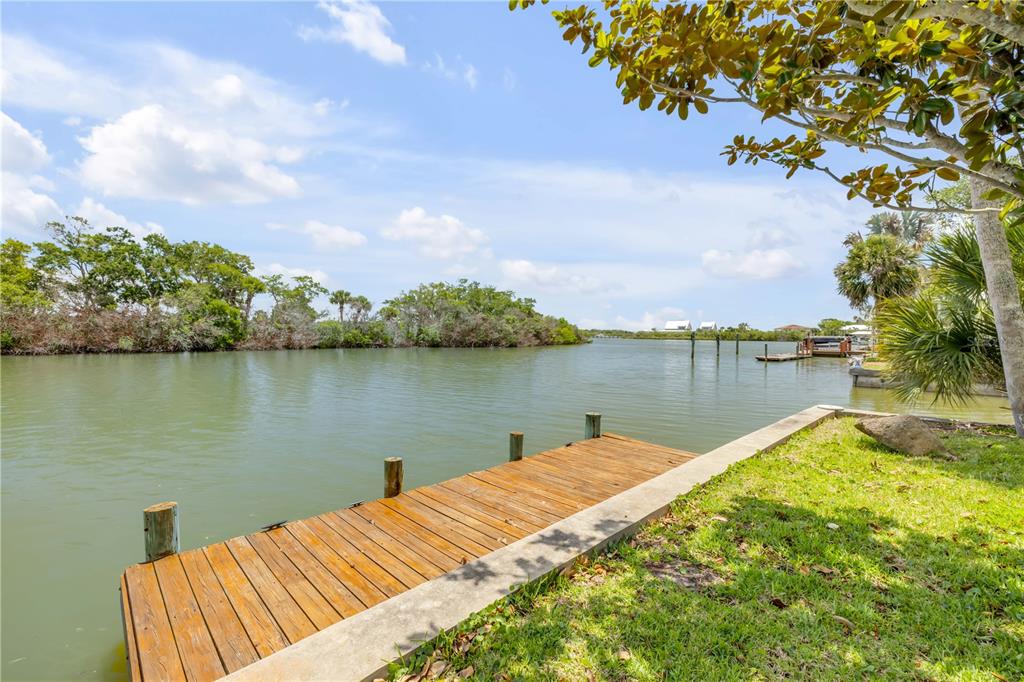 192 Azalea Road Edgewater, FL 32141 - Photo 6 of 94 a view of a lake with houses in the back