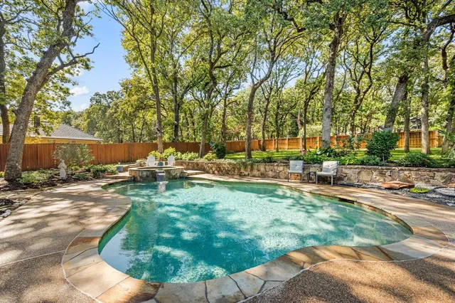 a view of a swimming pool with a patio
