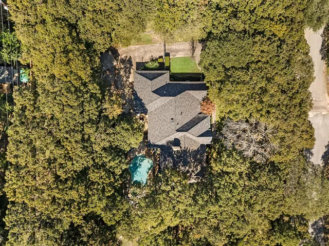 a aerial view of a house with a yard