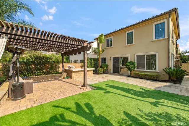 a view of a patio with couches and potted plants