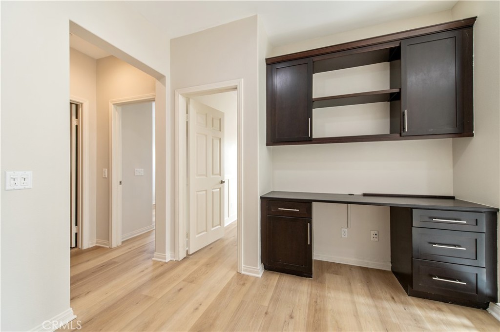 166 Desert Bloom Irvine, CA 92618 - Photo 23 of 36 a kitchen with granite countertop cabinets and oven
