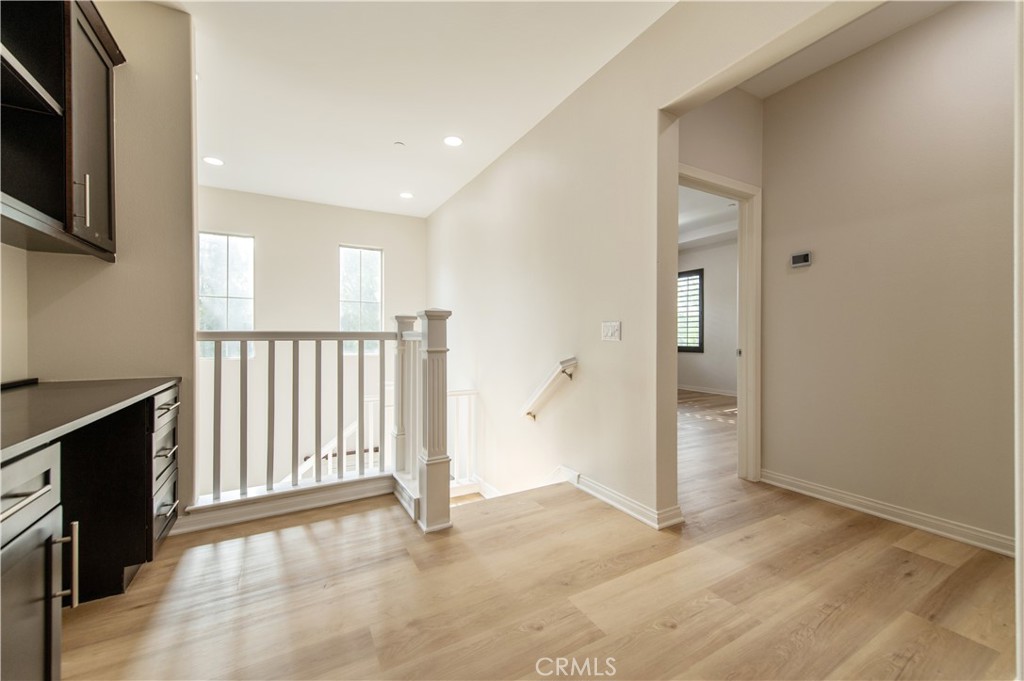 166 Desert Bloom Irvine, CA 92618 - Photo 24 of 36 a view of a livingroom with an empty space and a window