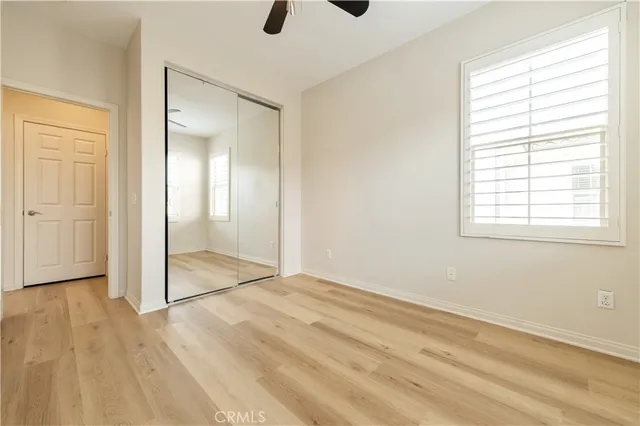 a bathroom with a granite countertop sink a mirror and a bathtub