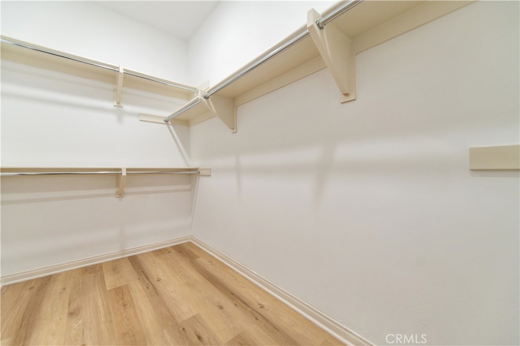 166 Desert Bloom Irvine, CA 92618 - Photo 36 of 36 a view of a room with racks on the wall