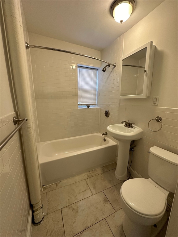 103 Summer Street, Unit 112 Malden, MA 02148 - Photo 6 of 6 a bathroom with a toilet and a shower
