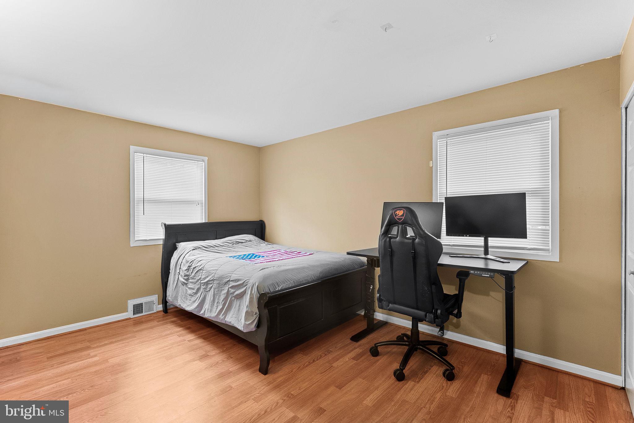 6313 Bardu Avenue Springfield, VA 22152 - Photo 14 of 26 a bedroom with a workspace