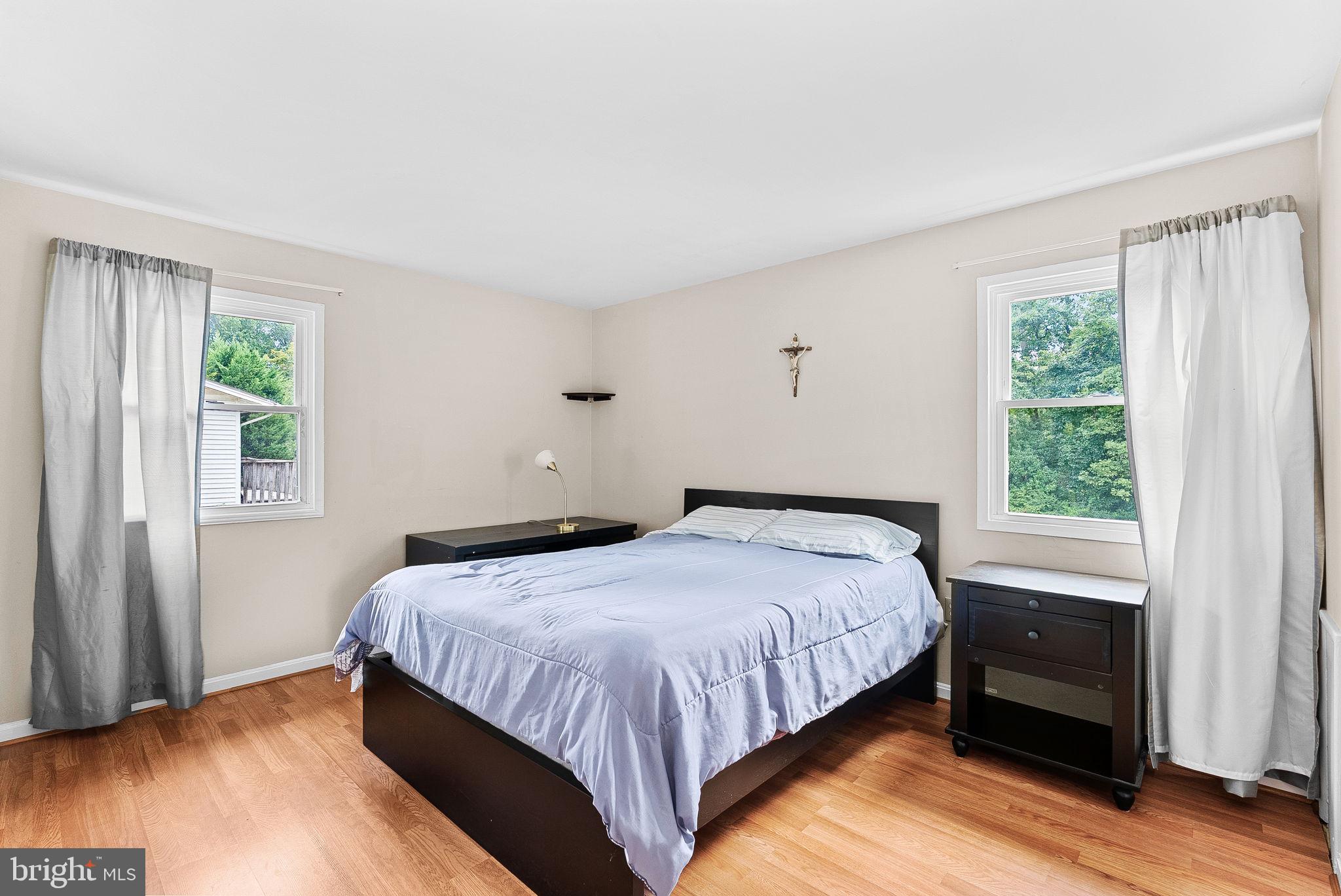 6313 Bardu Avenue Springfield, VA 22152 - Photo 17 of 26 a bedroom with a bed and a window