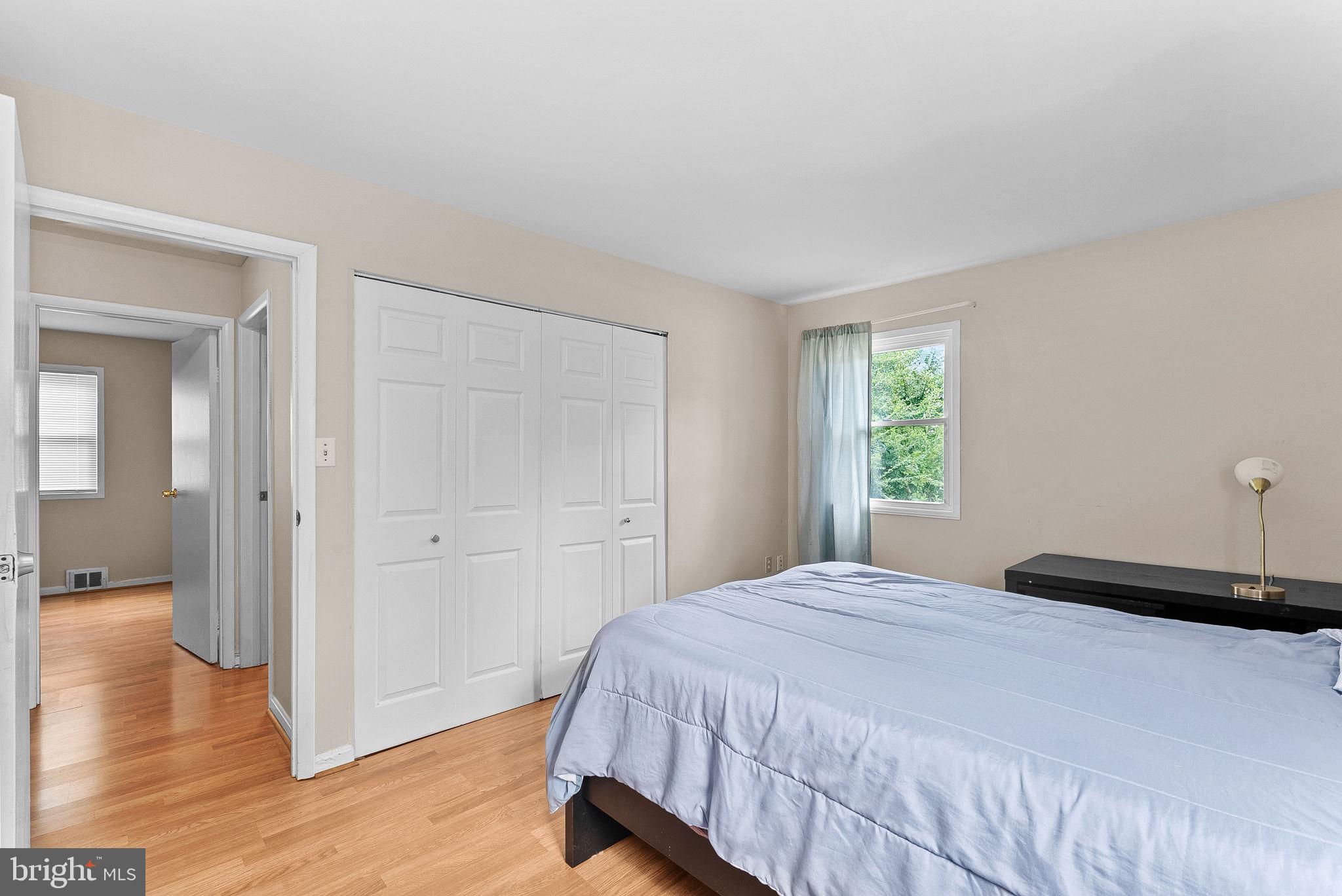 6313 Bardu Avenue Springfield, VA 22152 - Photo 18 of 26 a bedroom with a bed and a window