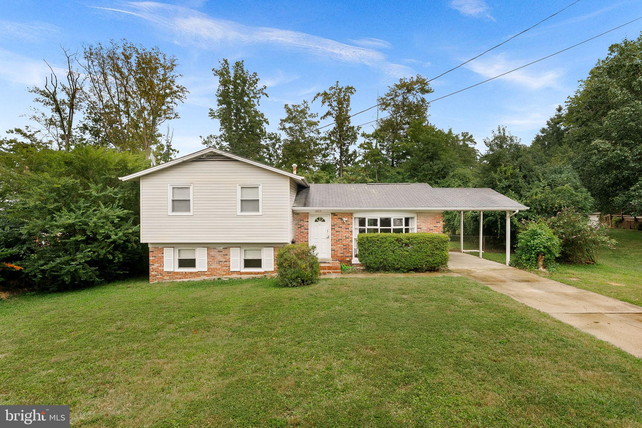6313 Bardu Avenue Springfield, VA 22152 - Photo 2 of 26 a view of a house with a yard