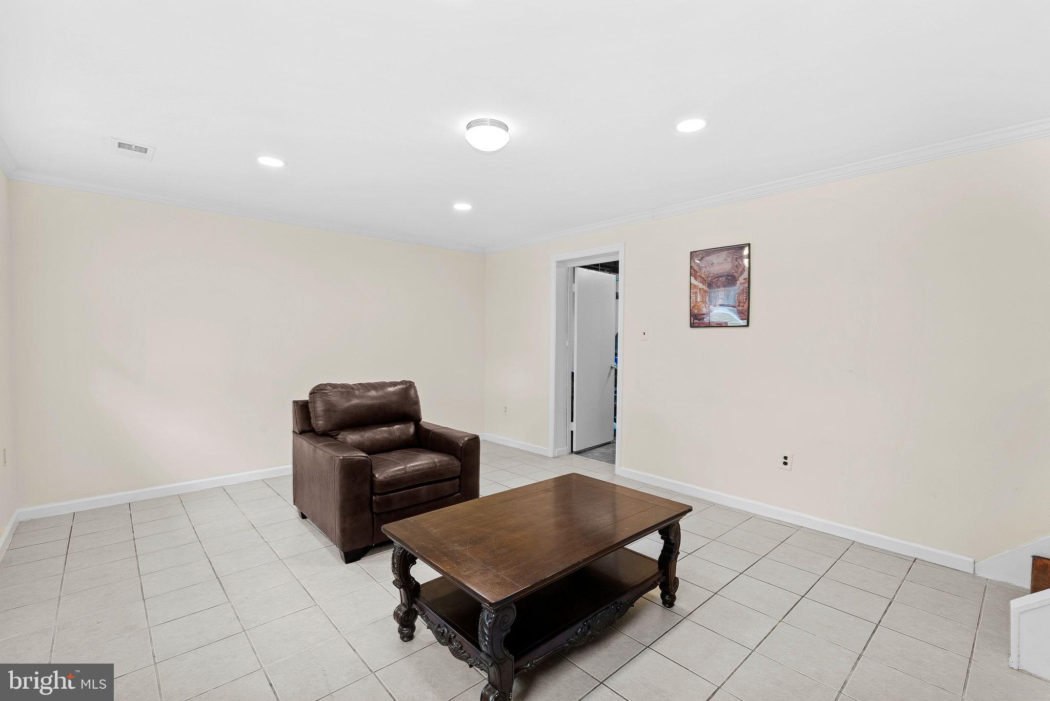 6313 Bardu Avenue Springfield, VA 22152 - Photo 23 of 26 a living room with furniture