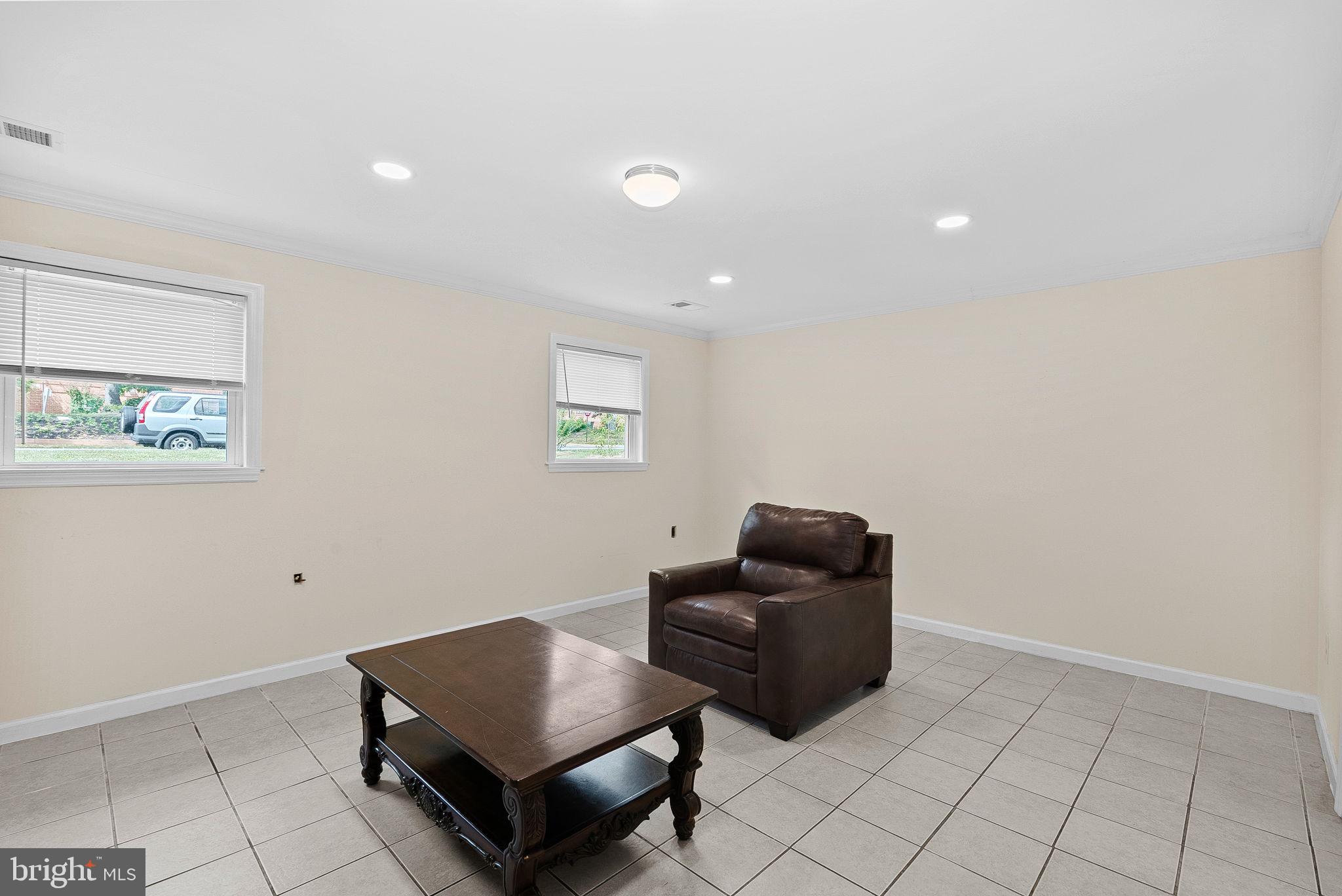 6313 Bardu Avenue Springfield, VA 22152 - Photo 24 of 26 a living room with furniture and a couch