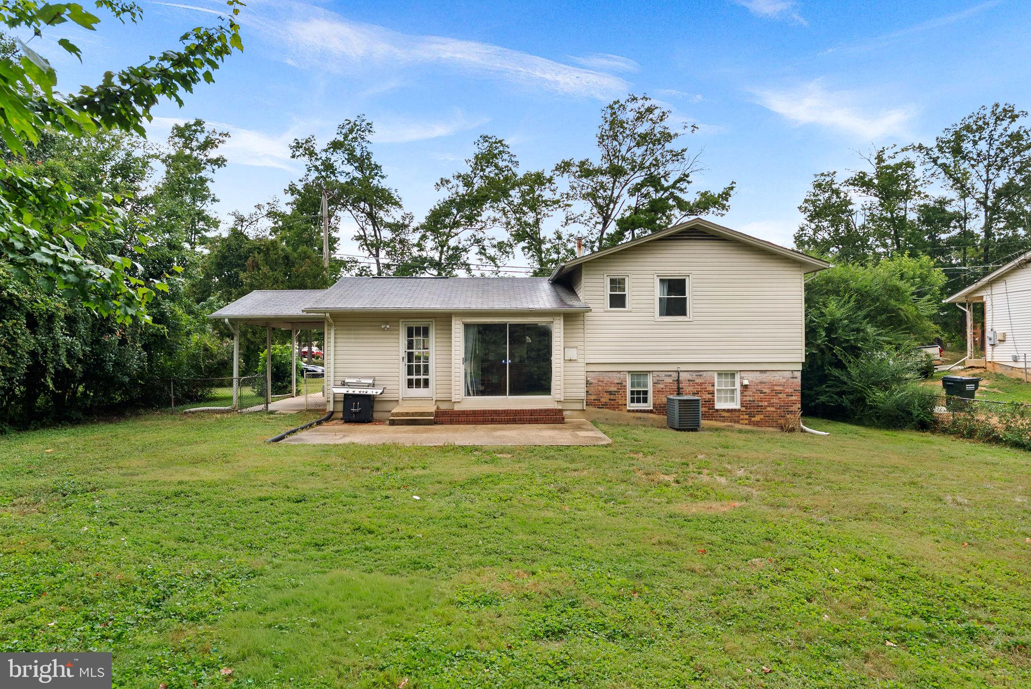 6313 Bardu Avenue Springfield, VA 22152 - Photo 25 of 26 a view of a house with a yard and sitting area
