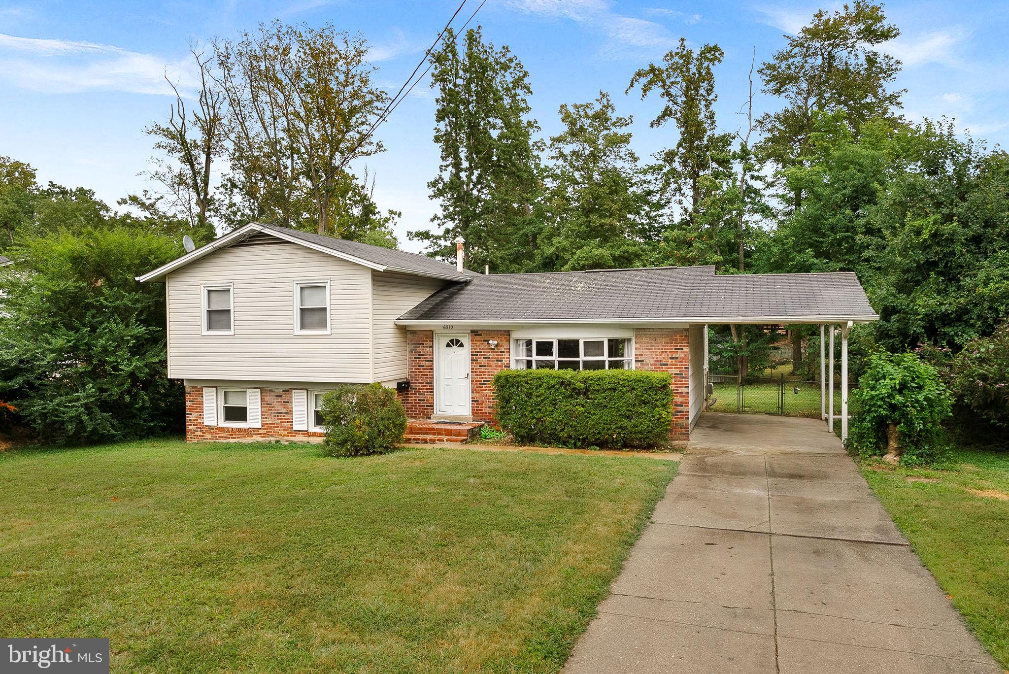 6313 Bardu Avenue Springfield, VA 22152 - Photo 3 of 26 a front view of a house with yard