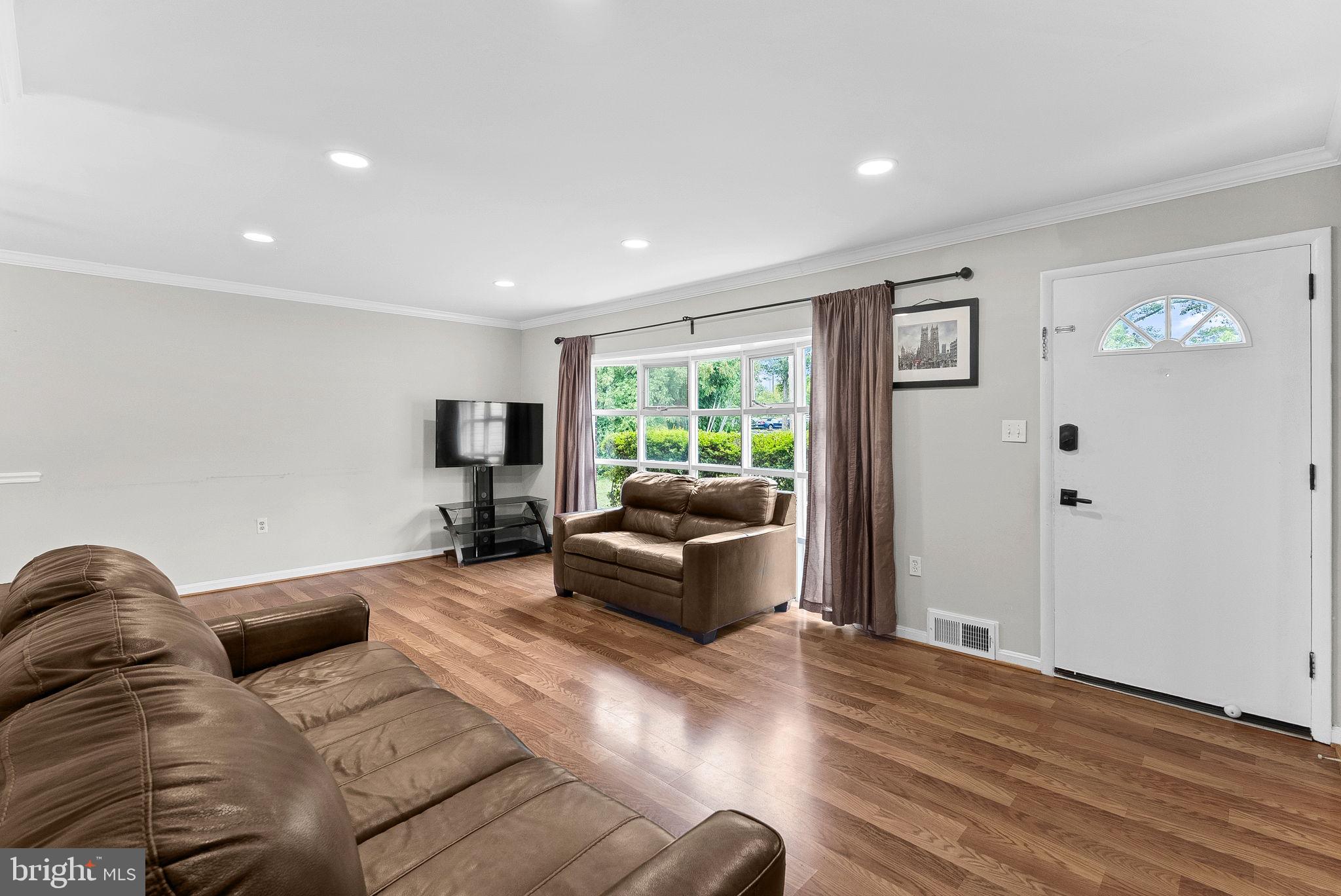 6313 Bardu Avenue Springfield, VA 22152 - Photo 5 of 26 a living room with furniture and a window