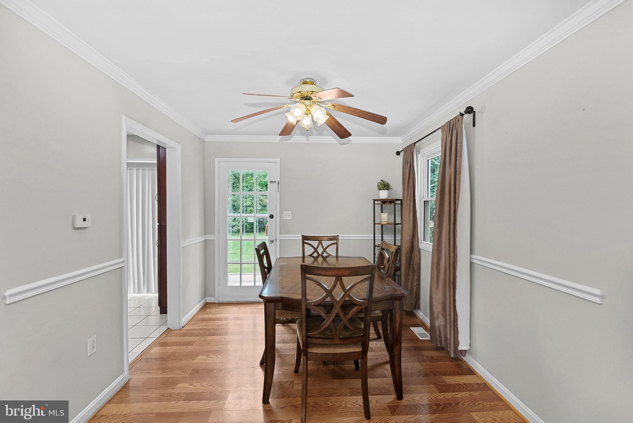 6313 Bardu Avenue Springfield, VA 22152 - Photo 8 of 26 a dining room with furniture and window