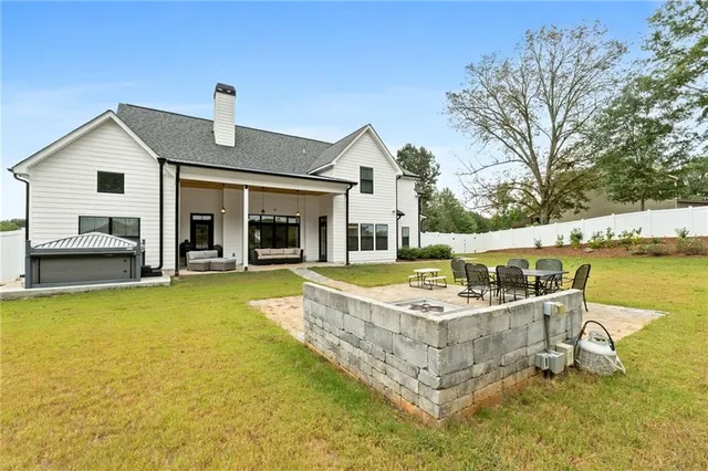 a living room with furniture fireplace and flat screen tv