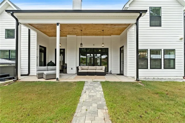 a kitchen with center island table and chairs