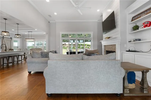 a kitchen with stainless steel appliances granite countertop a stove a sink a refrigerator and a microwave