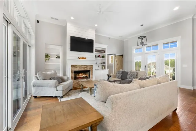 a bathroom with a granite countertop toilet sink and mirror