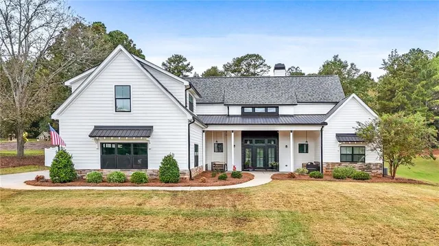 a front view of a house with a garage